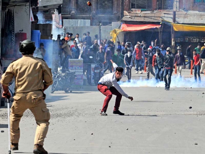 kashmiri protesters throw rocks and tear gas canisters at indian police during a demonstration in srinagar on friday photo reuters