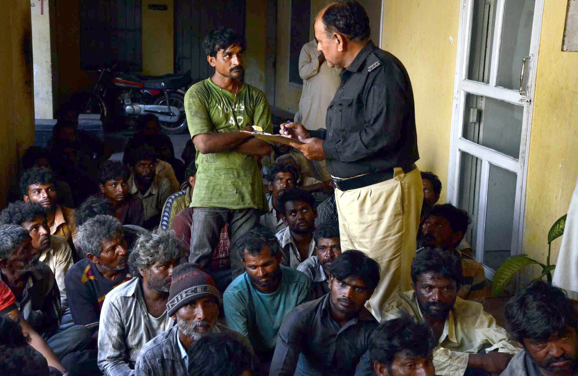 a policeman questions an indian fisherman caught violating territorial waters at docks police station photo muhammad azeem express