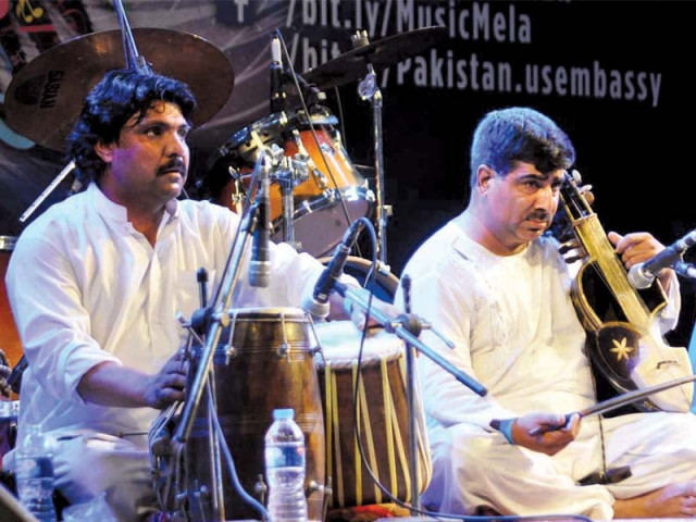 the event featured both traditional and international musical performances photos express the event featured both traditional and international musical performances photos express