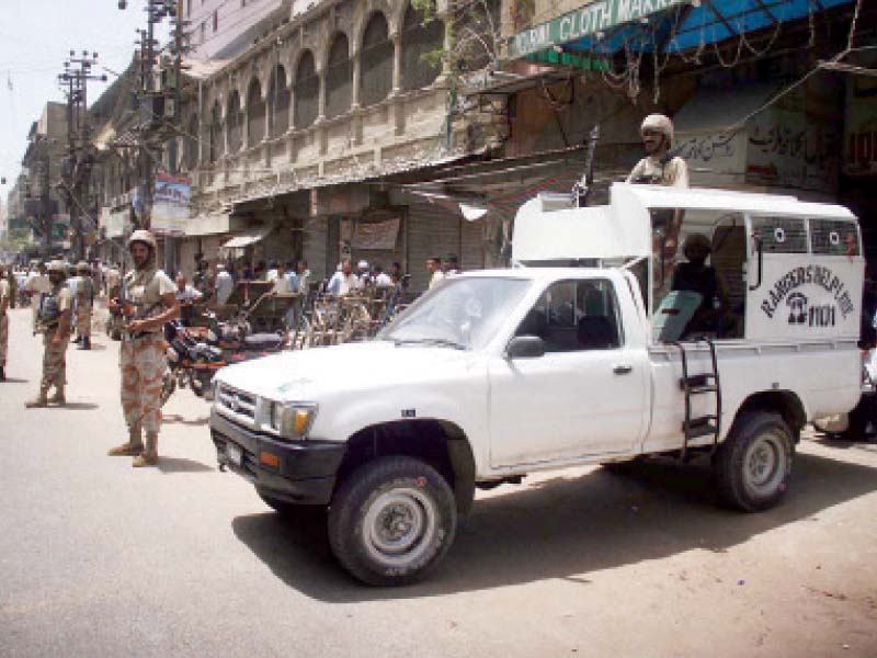 rangers personnel stand guard at boulton market following the grenade attack that left three men injured on saturday photo online