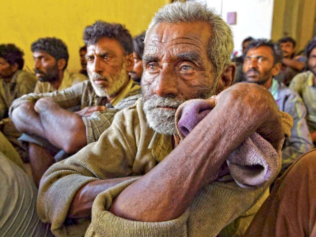 indian fishermen arrested for fishing in pakistani waters sit inside a police station in karachi photo afp indian fishermen arrested for fishing in pakistani waters sit inside a police station in karachi photo afp