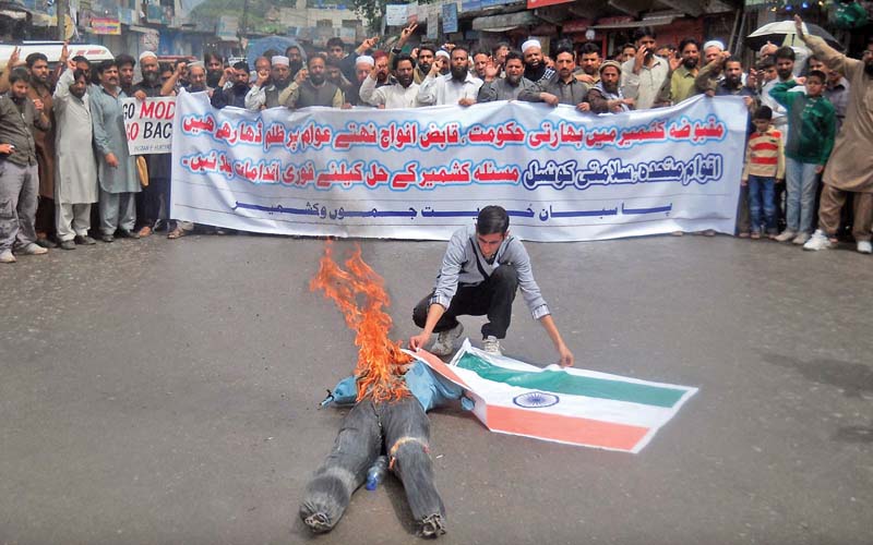 protesters in muzaffarabad march against human rights violations in indian held kashmir photo inp