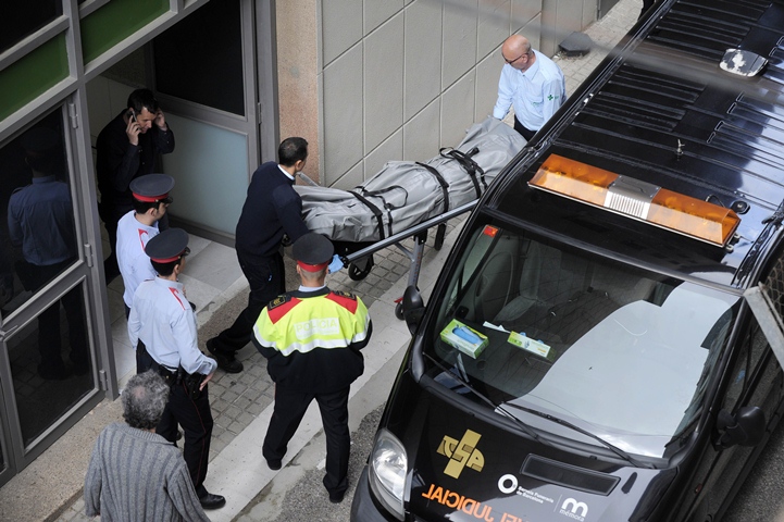 undertakers remove the body of a teacher who resulted dead at the joan fuster institute in barcelona on april 20 2015 after a student allegedly broke into the school armed with a crossbow killing him and wounding four others photo afp