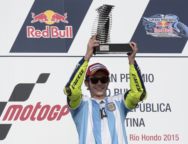 spanish rider marquez who won a record 13 races last season clipped rossi 039 s back wheel and crashed out as rossi raced on to victory from eighth on the grid photo afp