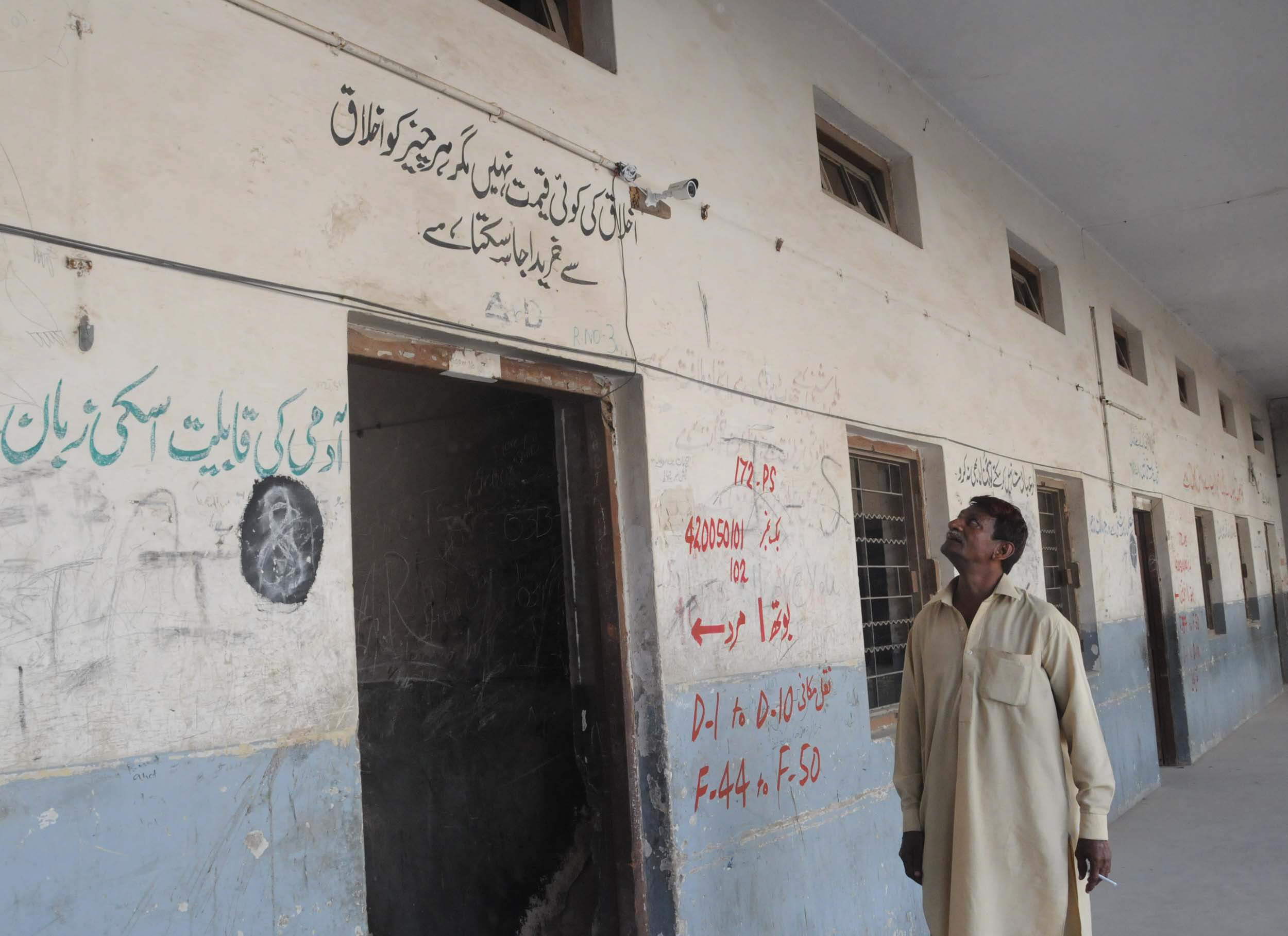 man looks on a wall inside a polling station in karachi 039 s na 246 constituency photo mohammad noman express