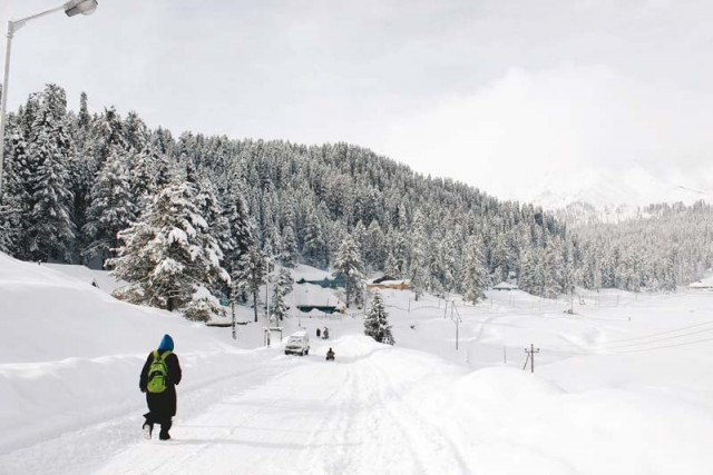a kashmiri boy walks down a road in gulmarg known to be a world class skiing destination photos haziq qadri a kashmiri boy walks down a road in gulmarg known to be a world class skiing destination photos haziq qadri