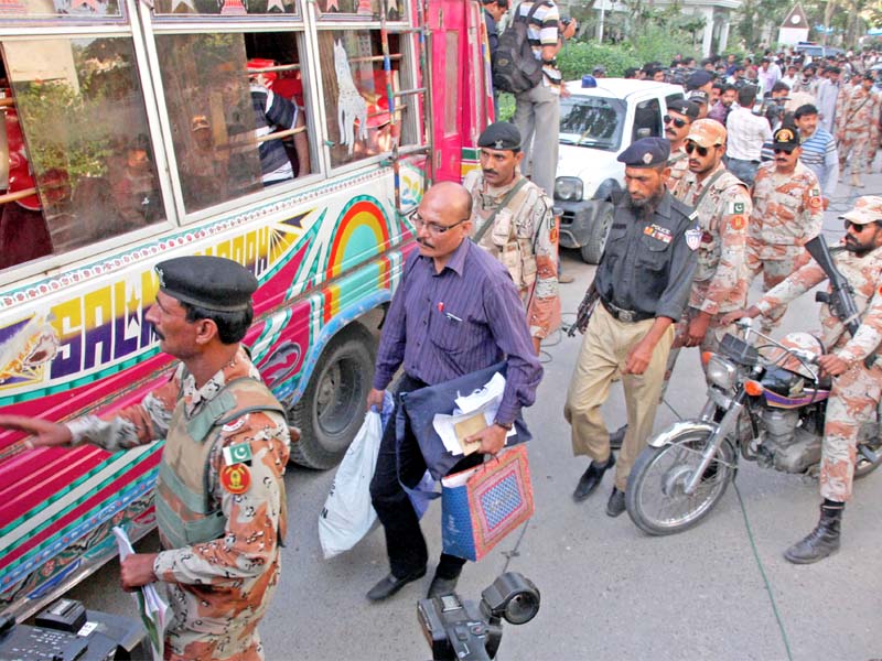 polling staff receive ballot papers and boxes at the district central deputy commissioner s office on wednesday the staff and law enforcers have been staying at the polling stations since wednesday evening photo athar khan express