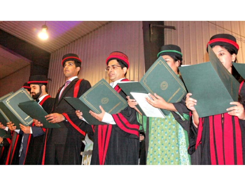 dressed in black robes lined with red students take the oath at the 12th convocation of ziauddin university on wednesday photo athar khan express