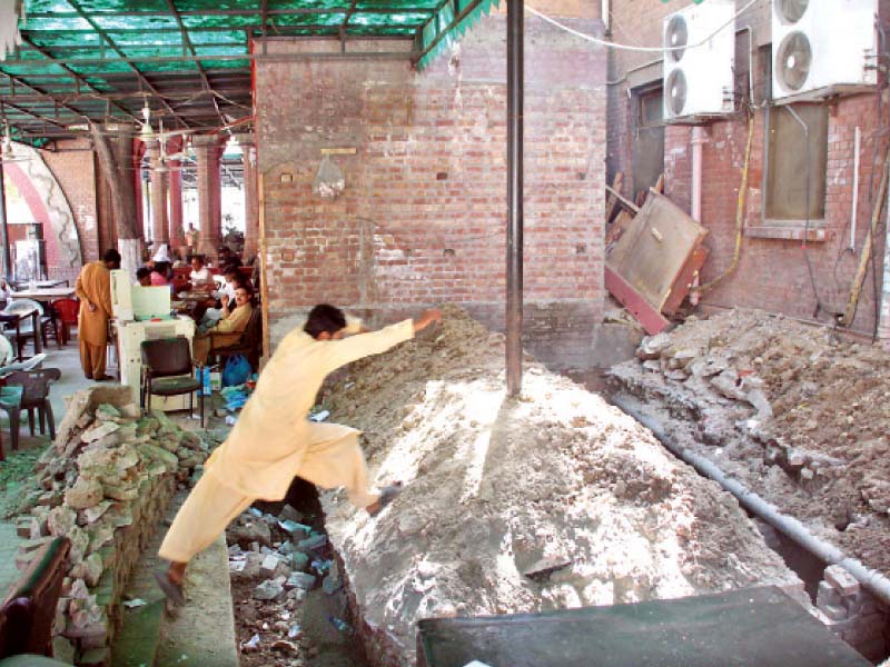 a construction worker jumps over a trench at the site photo abid nawaz express