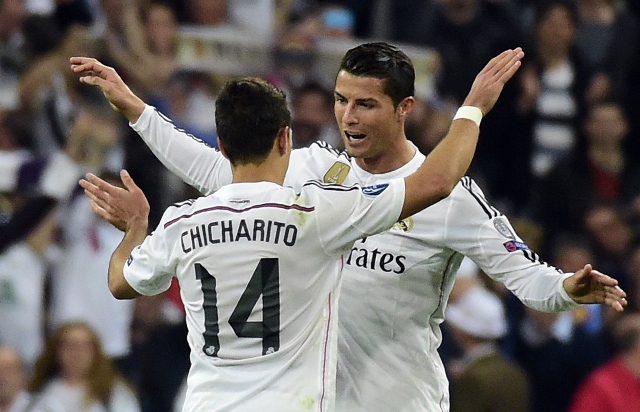 topshots real madrid 039 s portuguese forward cristiano ronaldo r congratulates teammate real madrid 039 s mexican forward javier hernandez l after the uefa champions league quarter finals second leg football match real madrid cf vs club atletico de madrid at the santiago bernabeu stadium in madrid on april 22 2015 real madrid won 1 0 photo afp