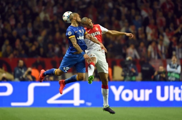 juventus 039 midfielder from chile arturo vidal l and monaco 039 s brazilian defender fabinho go for a header during the uefa champions league quarter final second leg football match as monaco vs juventus fc on april 22 2015 at the louis ii stadium in monaco photo afp