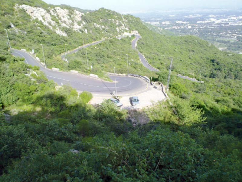 a view of the margalla hills overlooking the capital photo file