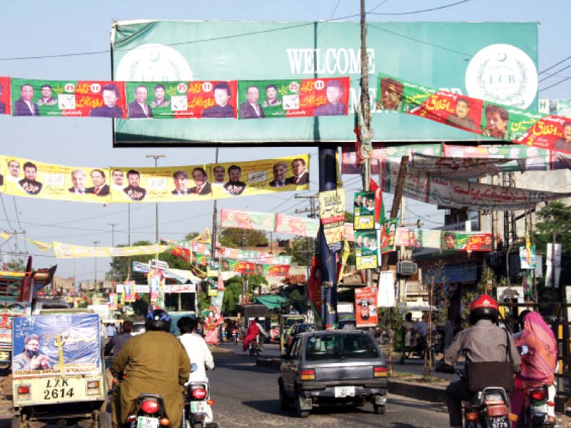 posters and banners crisscrossing each other on the busy saddar bazaar road in the lahore cantonment ahead of the cantonment board polls photo abid nawaz express