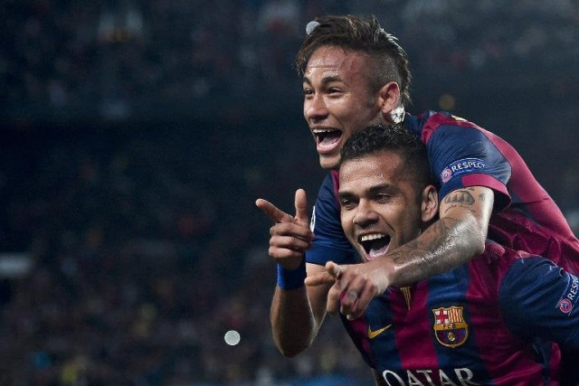 a file photo of barcelona players celebrating a goal photo afp