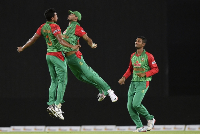 bangladesh cricketer taskin ahmed l celebrates with captain mashrafe bin mortaza c as mohammad mahmudullah looks onafter the dismissal of pakistan cricketer mukhtar ahmed during the t20 match between bangladesh and pakistan at the sher e bangla national cricket stadium in dhaka on april 24 2015 photo afp