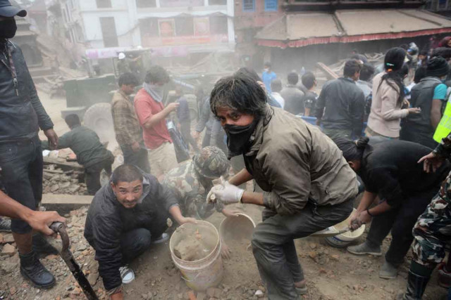 rescuers clear rubble in kathmandu photo afp rescuers clear rubble in kathmandu photo afp