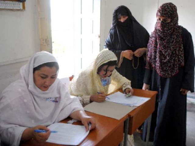 voters check their names in polling lists during cantonment board elections in peshawar photo ppi voters check their names in polling lists during cantonment board elections in peshawar photo ppi