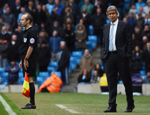 manchester city 039 s chilean manager manuel pellegrini r looks on during the english premier league football match between manchester city and aston villa at the etihad stadium in manchester north west england on april 25 2015 photo afp