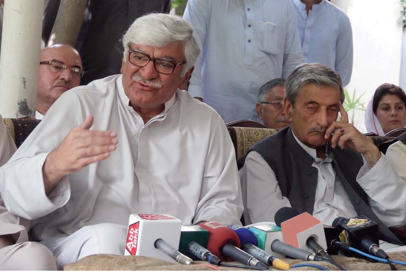 party chief asfandyar wali khan talks to journalists at bilour house photo express