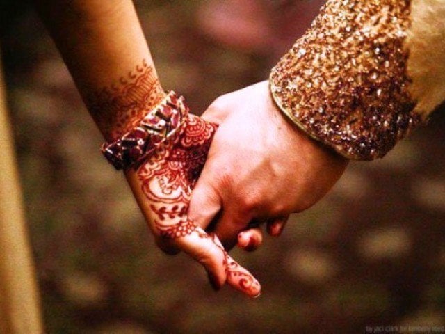 punjabi wedding couples holding hands