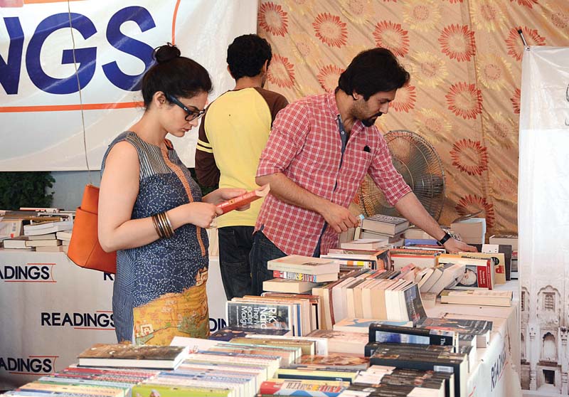 visitors go through books at one of the stalls set up at the three day festival photo huma choudhary express