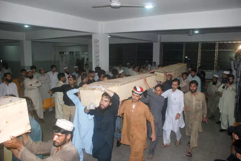relatives carry the bodies of victims from the lrh in peshawar photo iqbal haider express relatives carry the bodies of victims from the lrh in peshawar photo iqbal haider express