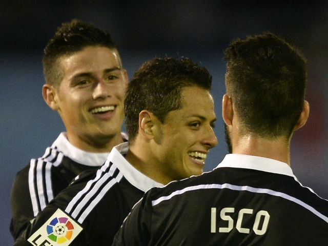 real madrid 039 s colombian midfielder james rodriguez l celebrates with teammates midfielder isco r and mexican forward javier hernandez after scoring a goal during the spanish league football match celta vigo vs real madrid cf at the balaidos stadium in vigo on april 26 2015 real madrid won 4 2 photo afp