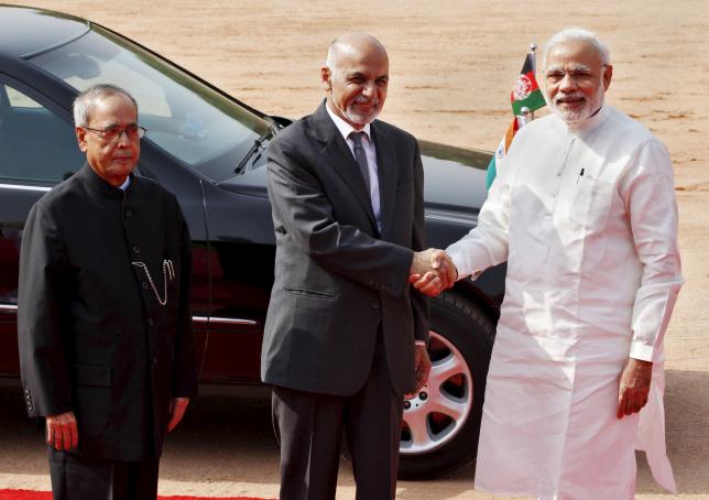 afghanistan 039 s president ashraf ghani c shakes hands with india 039 s prime minister narendra modi r as his indian counterpart pranab mukherjee looks on upon ghani 039 s arrival to attend a ceremonial reception at the forecourt of india 039 s presidential palace photo reuters