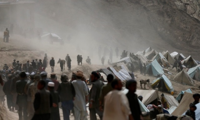 afghan villagers gather near the site of a previous landslide in badakhshan province in may 2014 photo reuters