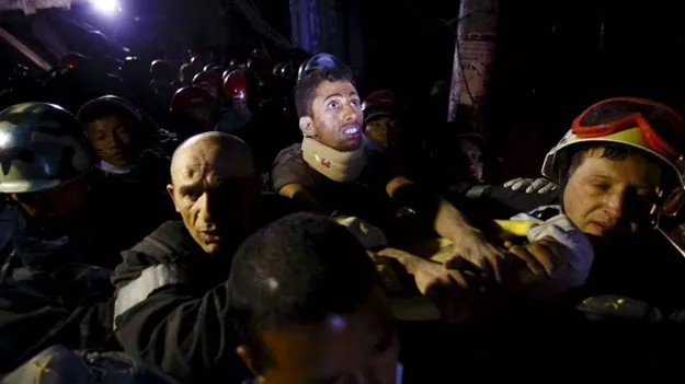 rishi khanal looks around at the surroundings as he is pulled from the rubble of a building after four days trapped photo reuters rishi khanal looks around at the surroundings as he is pulled from the rubble of a building after four days trapped photo reuters