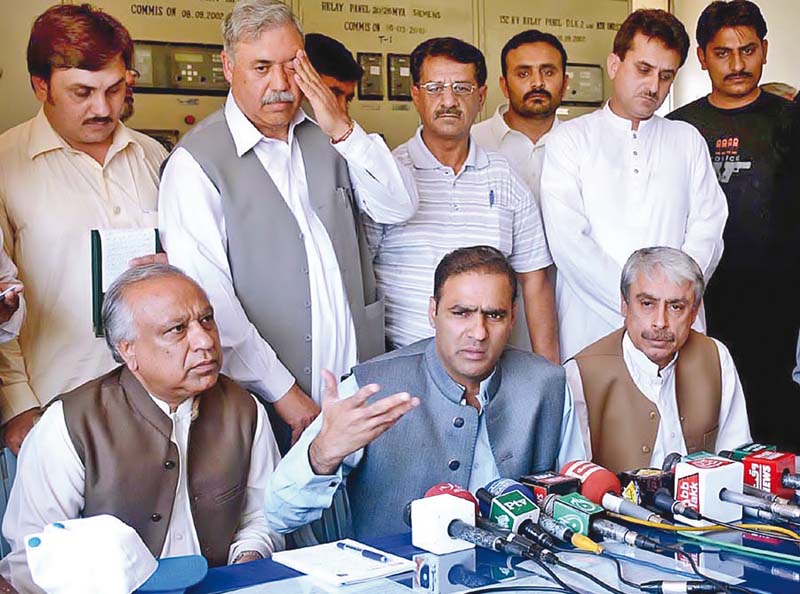 federal minister for water and power abid sher ali addresses a news conference photo app