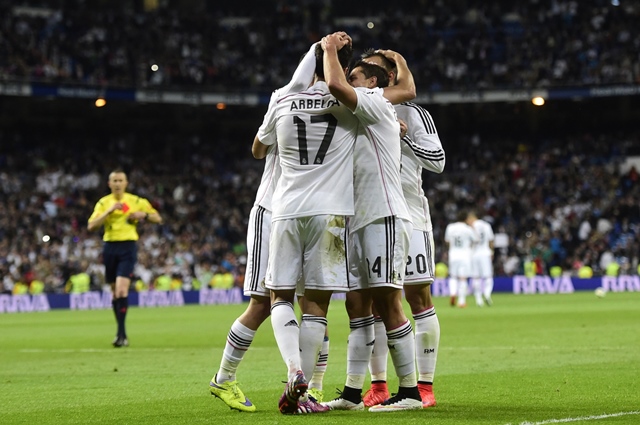 real madrid players celebrate after scoring a goal during the spanish league football match real madrid cf vs ud almeria at the santiago bernabeu stadium in madrid on april 29 2015 photo afp