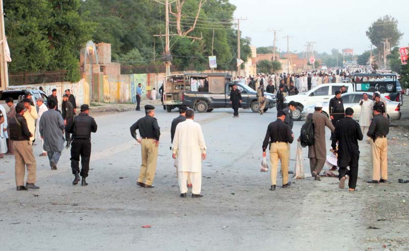 security officials cordon off the site of the suicide attack on aftab khan sherpao in charsadda photo afp