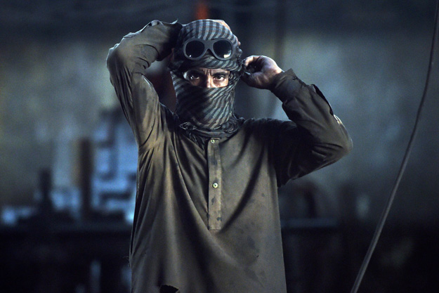 pakistani labourers work at an iron factory in karachi on april 30 2015 on the eve of international labour day photo afp