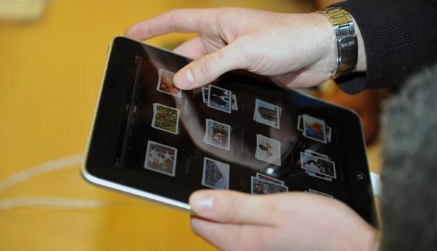 a trial programme announced by japan post ibm and apple will see 1 000 seniors given ipads free of charge for six months starting from october photo afp