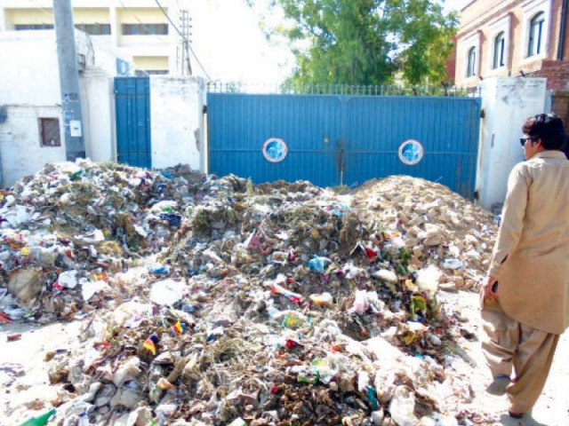 heaps of garbage block main entrance at wapda office photo express heaps of garbage block main entrance at wapda office photo express