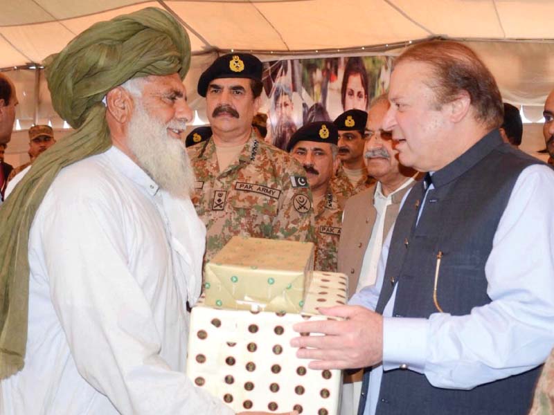 prime minister nawaz sharif distributes gifts among the families returning to north waziristan photo app
