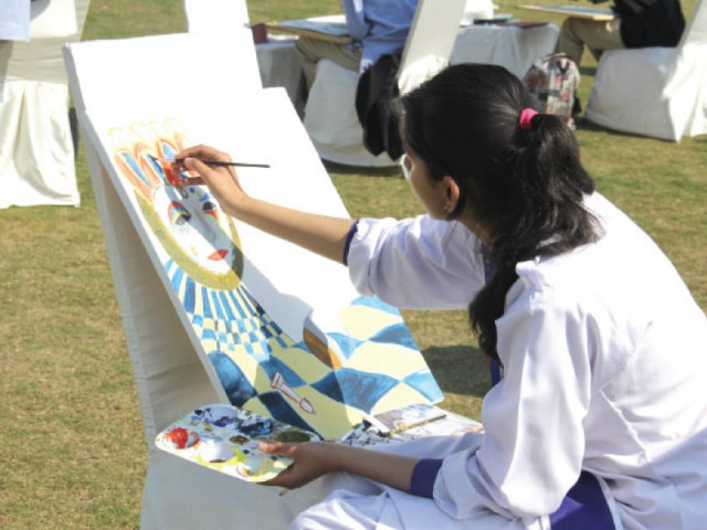 a student paints at a competition photo ayesha mir express a student paints at a competition photo ayesha mir express