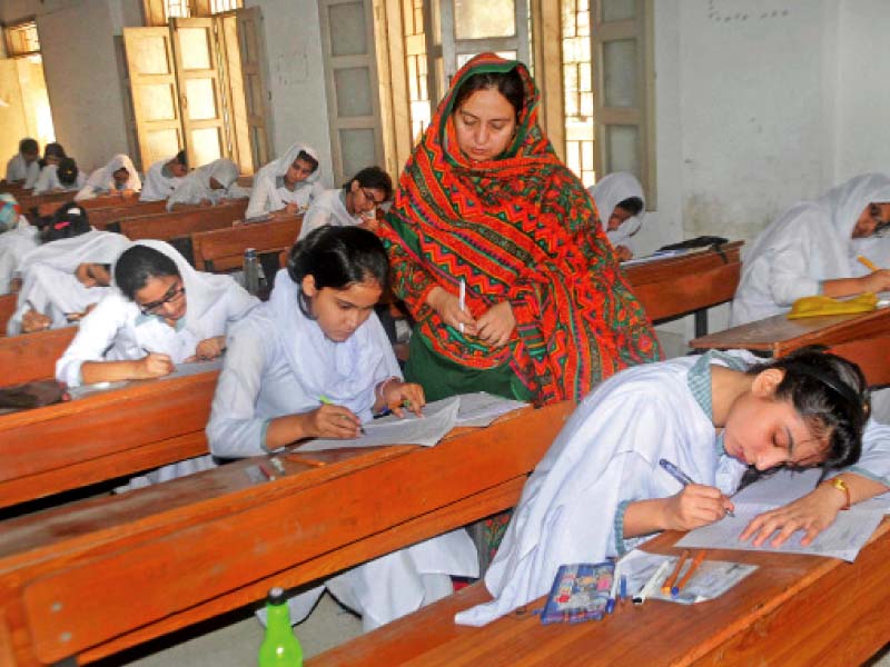 students appear for intermediate exams at a centre in karachi numerous candidates have been caught cheating across the province since the exams started this week photo file