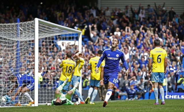 the belgian headed in after julian speroni had parried his self won penalty late in the first half to register his 19th goal of the season and carry jose mourinho 039 s side over the line with three games to spare photo afp