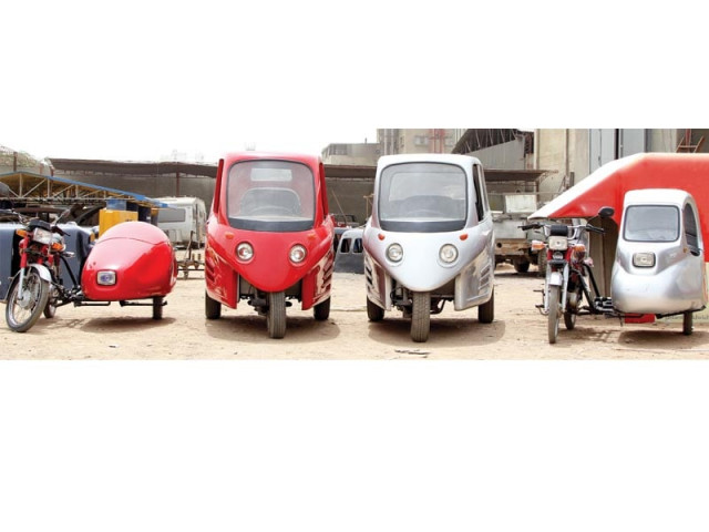 company working on three wheel car sidecars and pickups photo aysha saleem express company working on three wheel car sidecars and pickups photo aysha saleem express