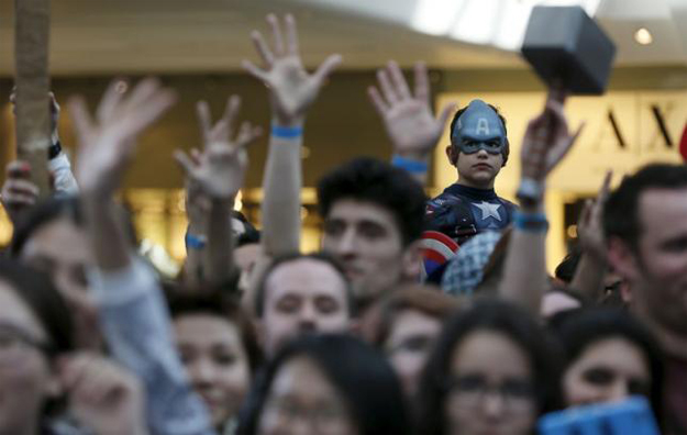 a boy dressed as captain america awaits the start of the european premiere of 039 039 avengers age of ultron 039 039 at westfield shopping centre photo reuters