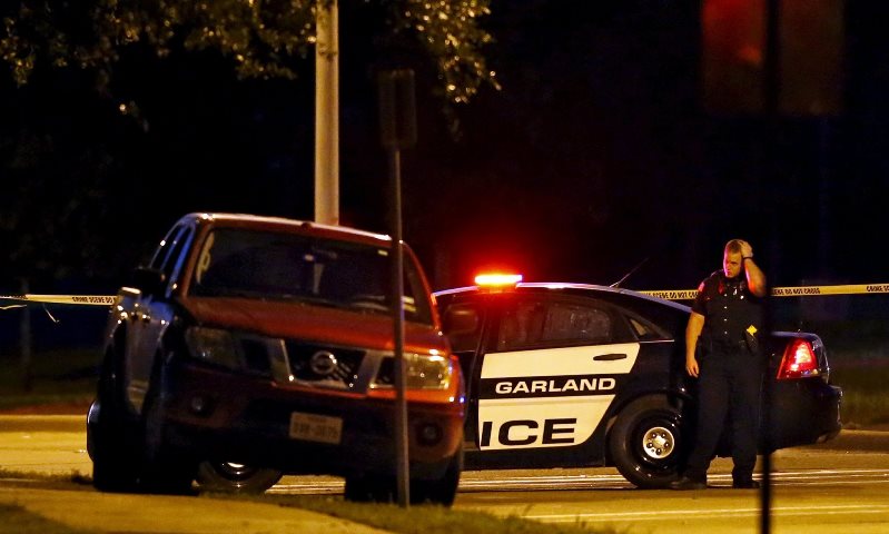 a police officer outside the art exhibit on sunday night where two gunmen opened fire in garland texas photo reuters