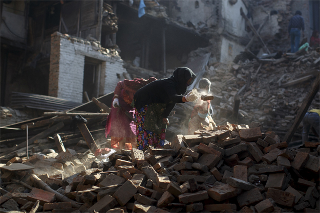 local residents clear the rubble from their homes which were destroyed after last week 039 s earthquake in bhaktapur nepal photo reuters