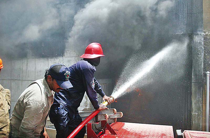 firefighters work to douse the blaze that erupted in a textile mill at site on monday eight factory workers sustained minor injuries while the building was destroyed photo online