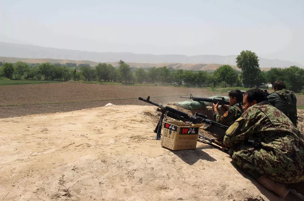 in this photograph taken on may 3 2015 afghan national army soldiers prepare to fire during a battle with taliban insurgents in kunduz intense fighting flared in northern afghanistan as security forces battled taliban insurgents advancing on a major provincial capital officials said with terrified residents fearing the fall of the besieged city hundreds of militants closed in on kunduz city after attacking outlying police and army checkposts on april 24 just hours after the taliban launched their annual spring offensive photo afp in this photograph taken on may 3 2015 afghan national army soldiers prepare to fire during a battle with taliban insurgents in kunduz intense fighting flared in northern afghanistan as security forces battled taliban insurgents advancing on a major provincial capital officials said with terrified residents fearing the fall of the besieged city hundreds of militants closed in on kunduz city after attacking outlying police and army checkposts on april 24 just hours after the taliban launched their annual spring offensive photo afp