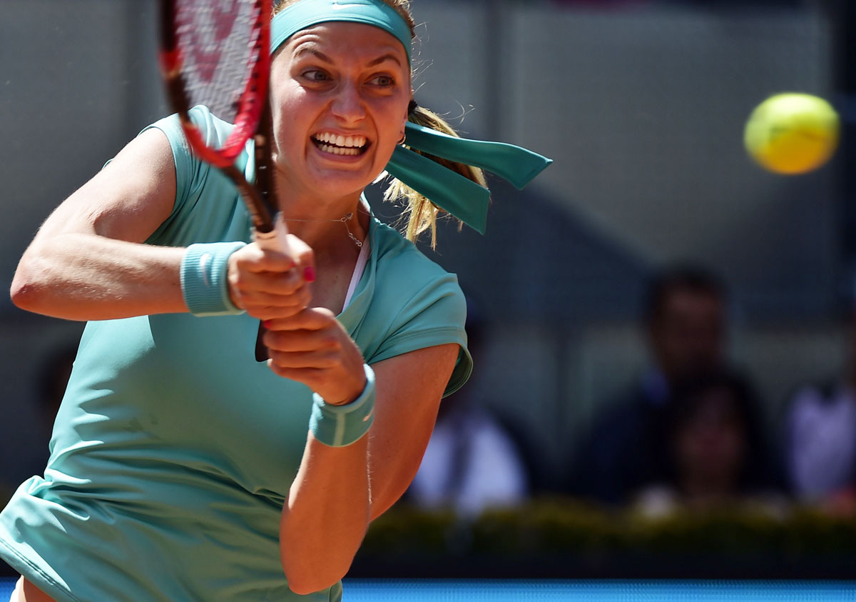 czech tennis player petra kvitova returns a ball during day four of the madrid open tournament at the caja magica magic box sports complex in madrid on may 5 2015 photo afp