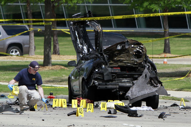 members of the fbi evidence response team investigate the crime scene outside of the curtis culwell center after a shooting occurred the day before on may 04 2015 in garland texas photo afp