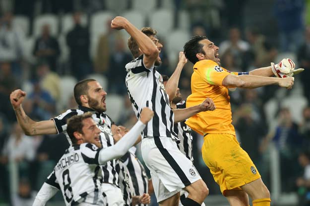 juventus 039 goalkeeper and captain gianluigi buffon r celebrates with teammates after winning 2 1 the uefa champions league semi final first leg football match juventus vs real madrid on may 5 2015 at the juventus stadium in turin photo afp