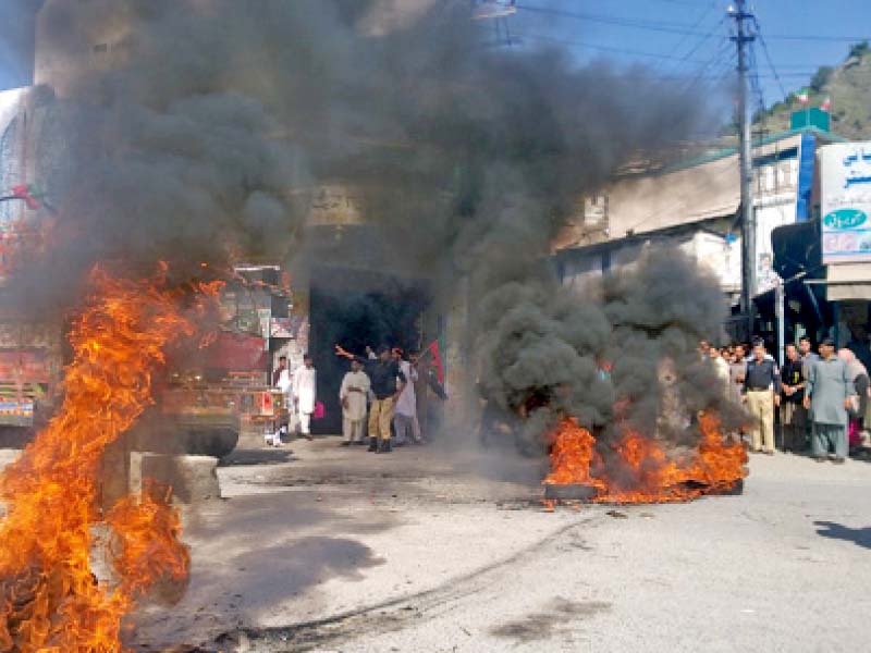 pti workers protest against k p president azam swati and provincial minister mushtaq ghani photo express